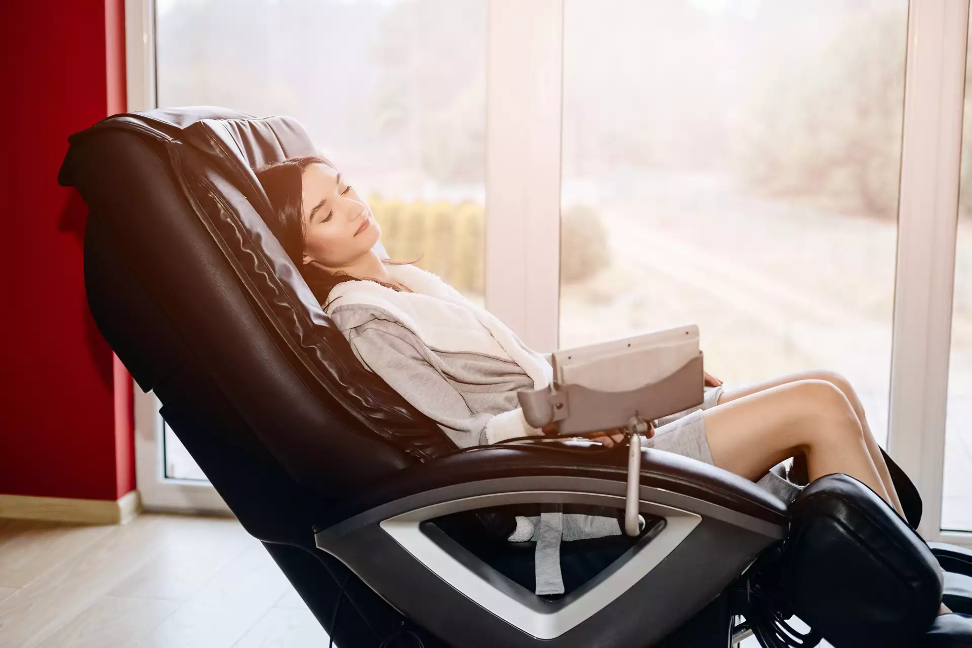 girl sleeping on massage chair of high end luxury barbershop